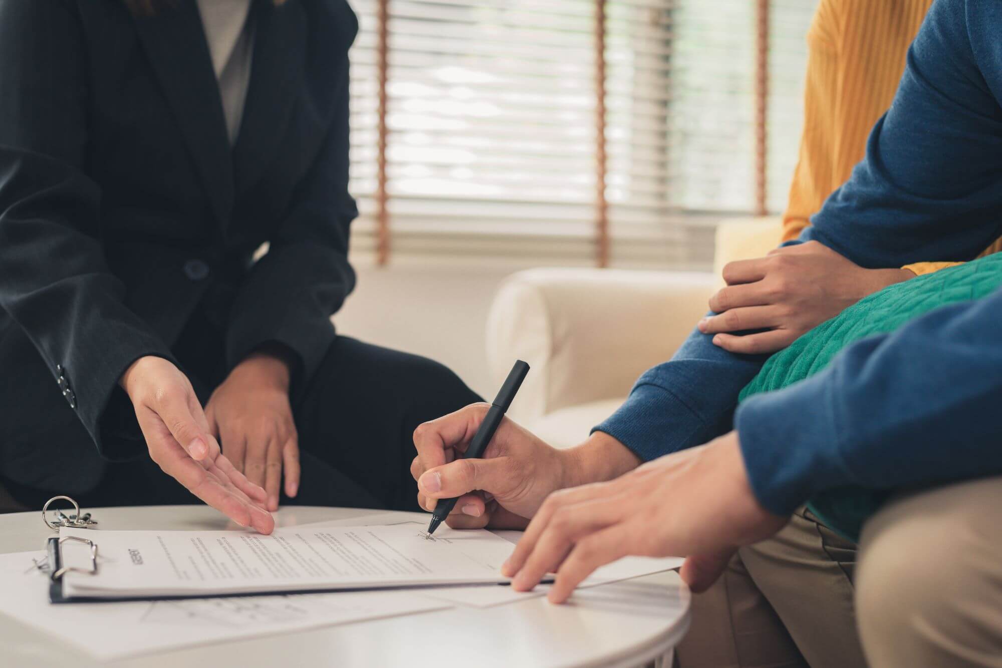 happy-young-asian-couple-victim of consumer fraud and deceptive practice signing a contract